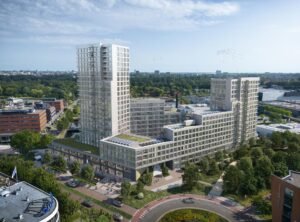 Luchtfoto van het moderne appartementencomplex aan de H.J.E. Wenckebachweg in Amsterdam, omringd door groen en andere kantoorgebouwen.